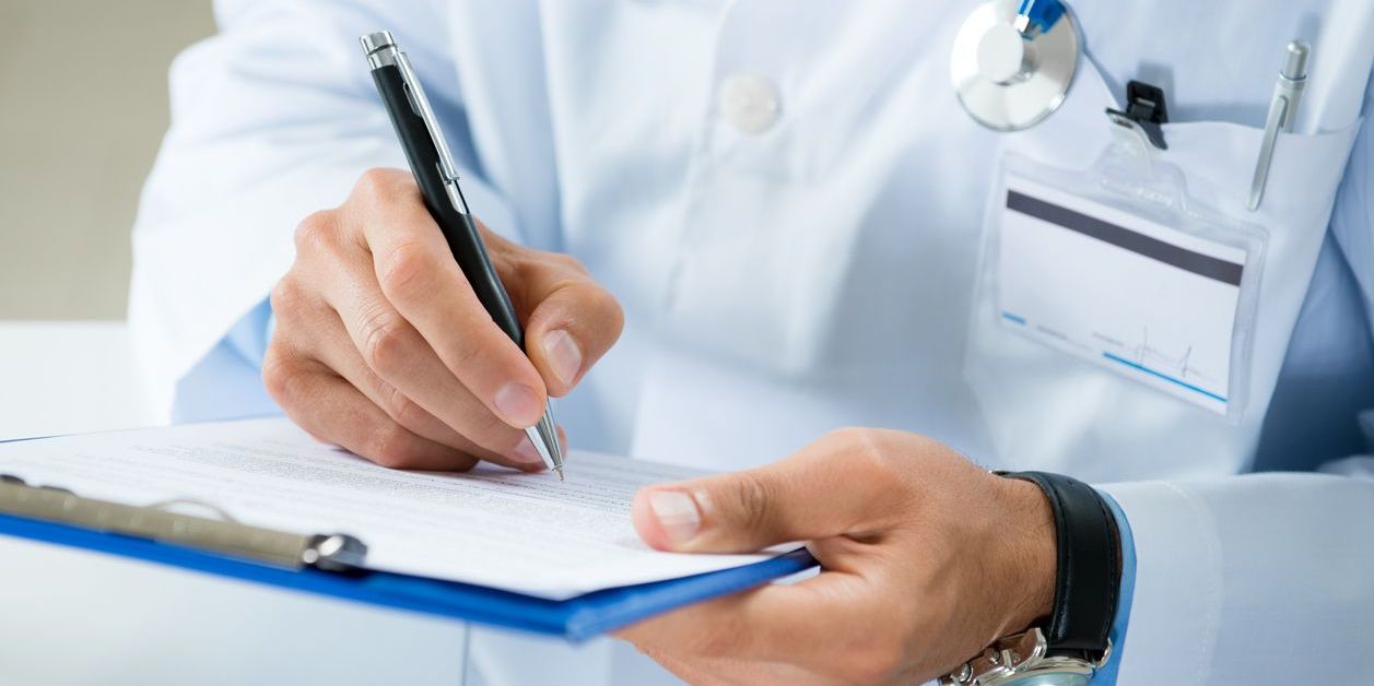doctor writing prescription for suboxone