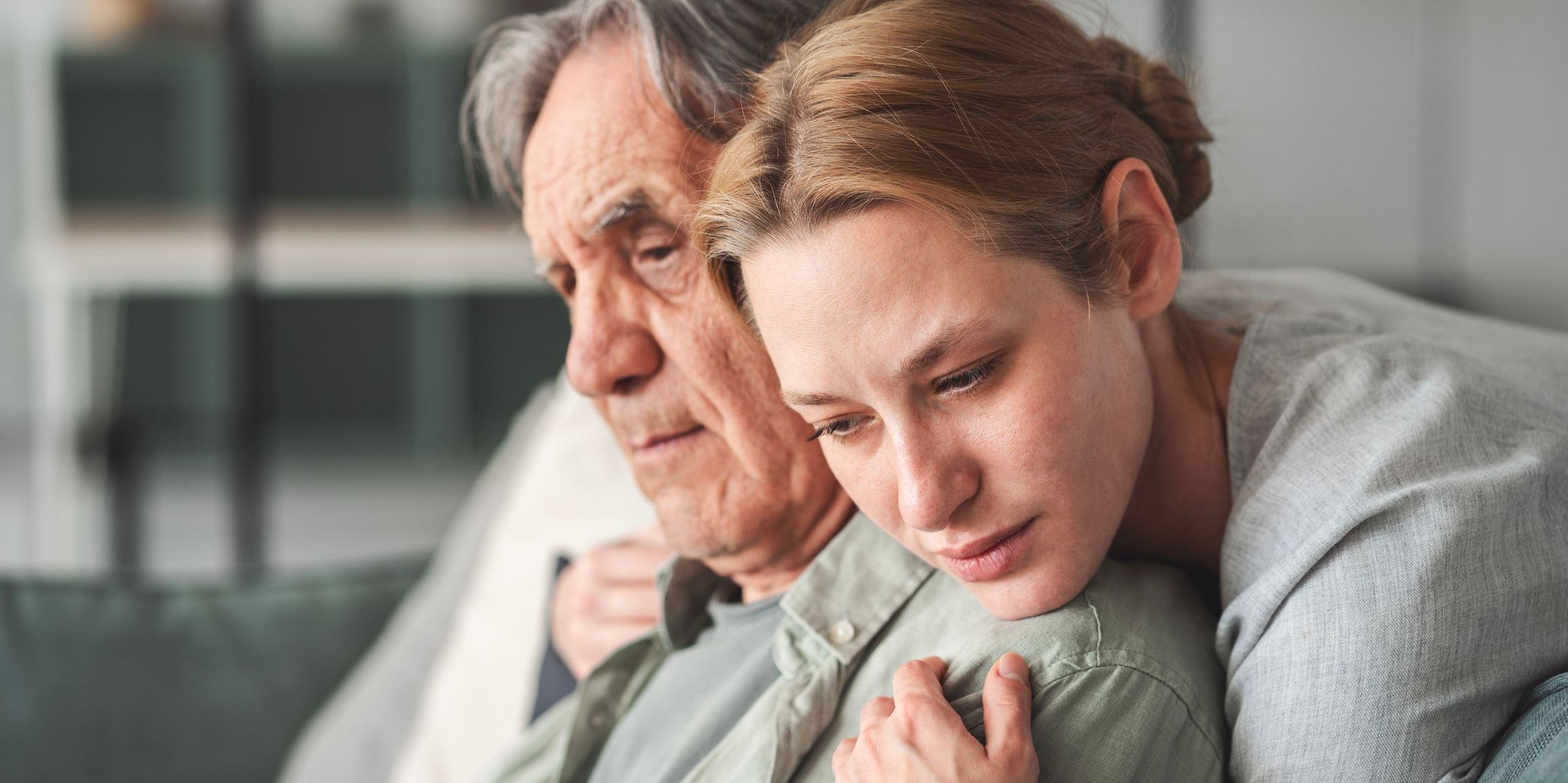 daugther comforting father experiencing grief and loss