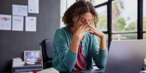 woman with trauma feeling stressed at work
