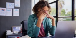 woman with trauma feeling stressed at work