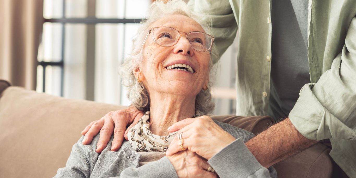 elderly woman with dementia with caregiver