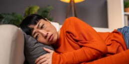severely depressed woman lying down